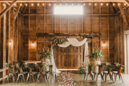 A wedding ceremony in the barn at Cave Spring Vineyard.