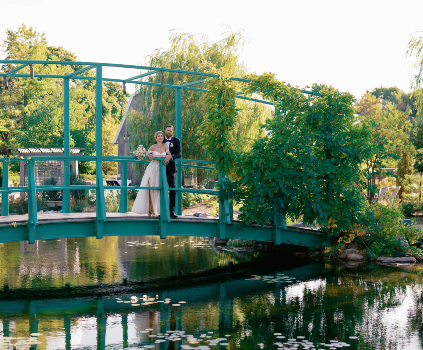 Wedding couple in the monet-inspired gardens at Pillar and Post in Niagara-on-the-Lake