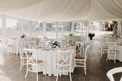 All-white décor at a tented wedding