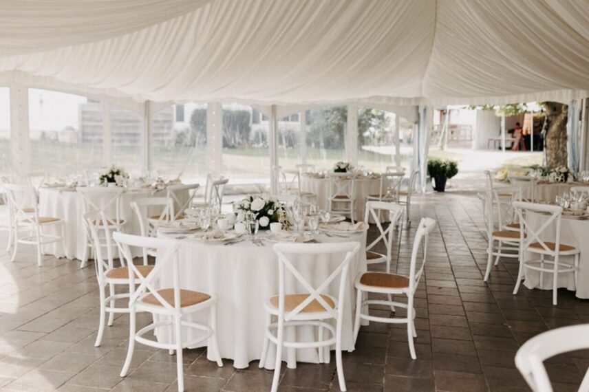 All-white décor at a tented wedding
