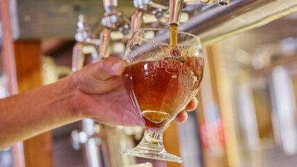 Beer being poured at a craft brewery near Inn On The Twenty