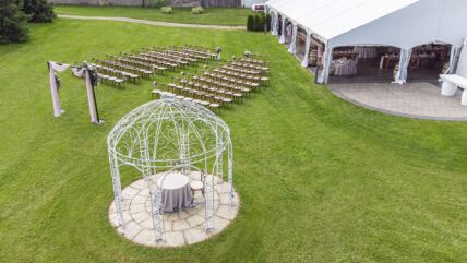 Winery wedding ceremony set up with wedding reception tent at Sue Ann Staff Estate Winery