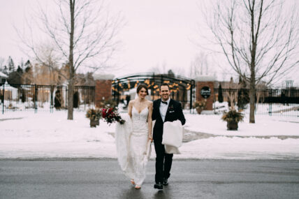 A bride at Pillar and Post carrying her winter bouquet