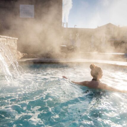 A woman enjoying the hot spring pools at Millcroft Inn & Spa.