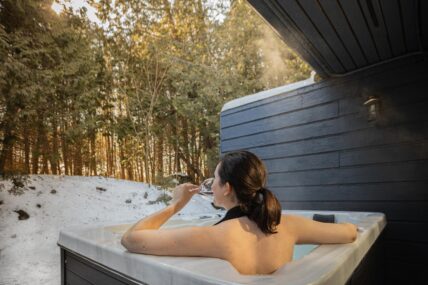 A woman relaxing in the Crofts private hot tub.
