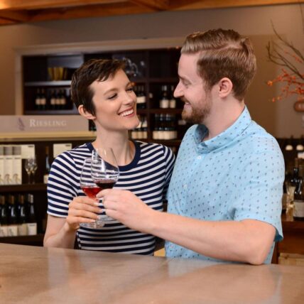 A couple enjoying wine during their March Madness Getaway in Niagara-on-the-Lake.