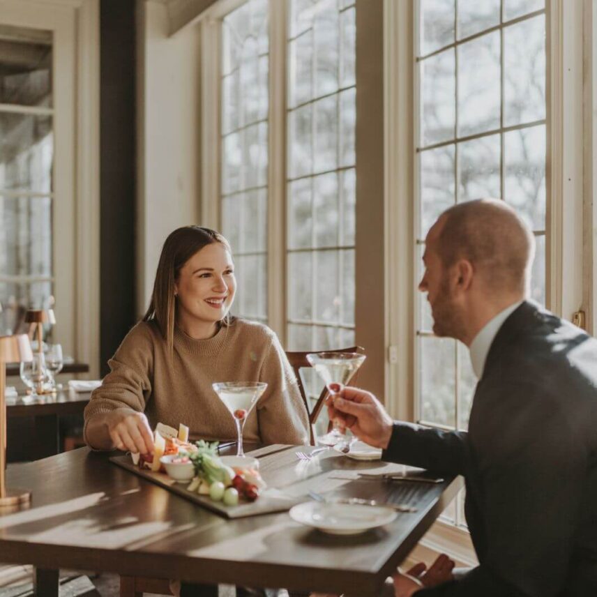 Two people enjoying an Icewine Lovers Getaway at Inn on the Twenty in Niagara-on-the-Lake, Ontario.
