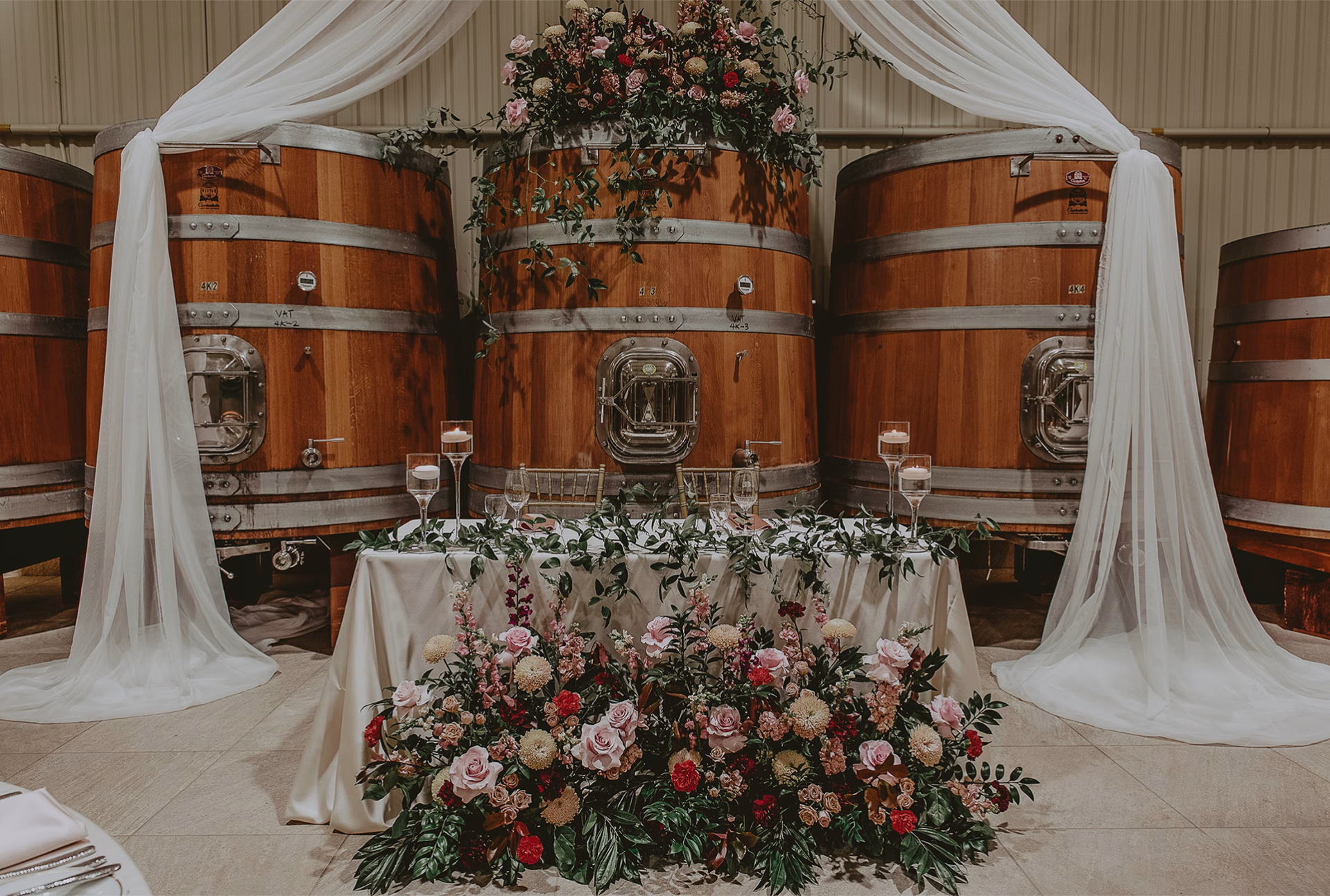 Groom and bride table at the Big Head Wines wedding venue in Niagara-on-the-Lake, Ontario.