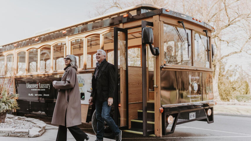 A couple going on the Vintage Hotels Wine Trolley Signature Tour in Niagara-on-the-Lake.
