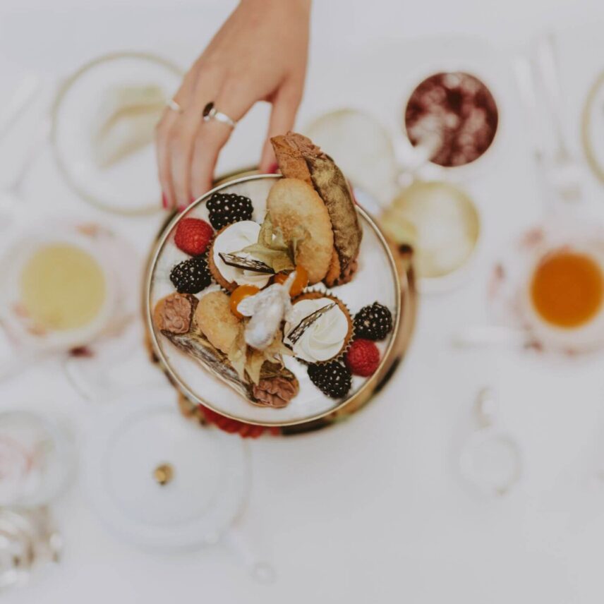 a girl enjoy springtime afternoon tea at headwaters restaurant at millcroft inn and spa