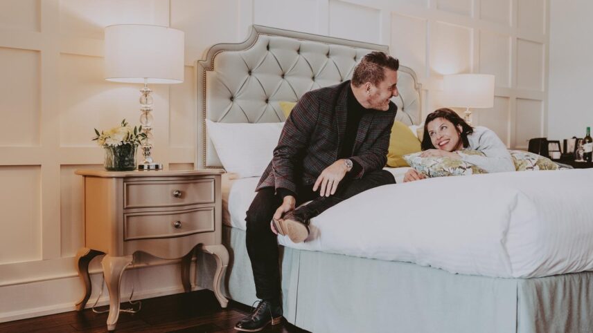 A couple enjoying their suite at Queen’s Landing in Niagara-on-the-Lake.