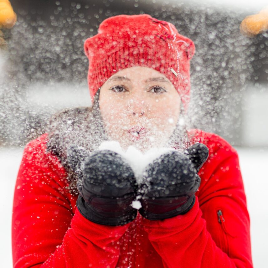 A young women skating at the outdoor winter rink in The Gardens at Pillar and Post in Niagara-on-the-Lake