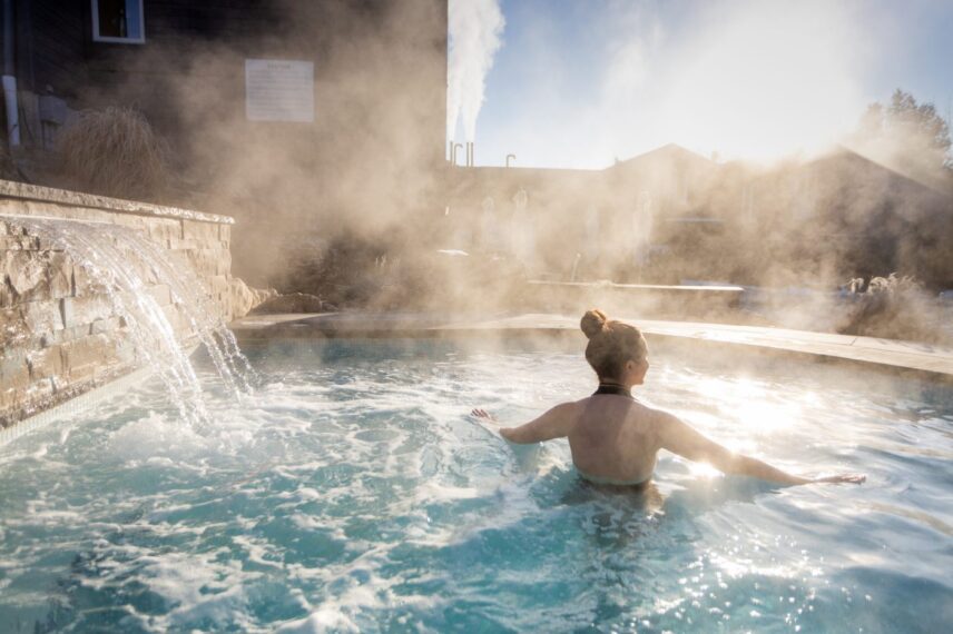 Woman relaxing in the hot spring pools at Millcroft Inn & Spa