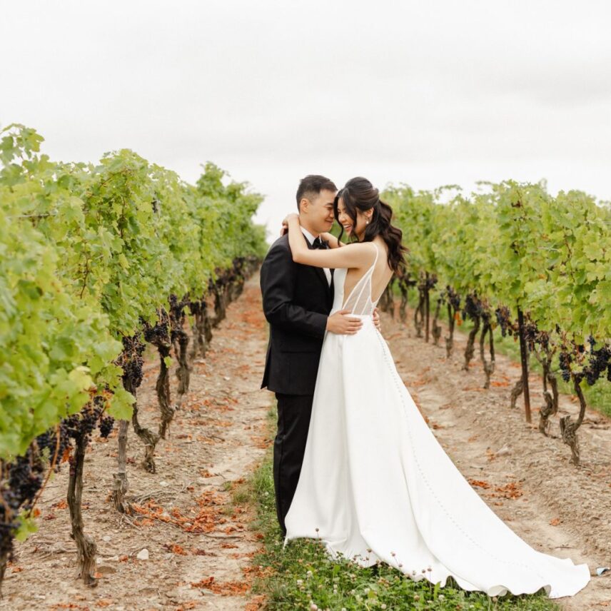 Spring Wedding Venue portraits a couple in the vineyard at Sue Ann Staff Estate Winery