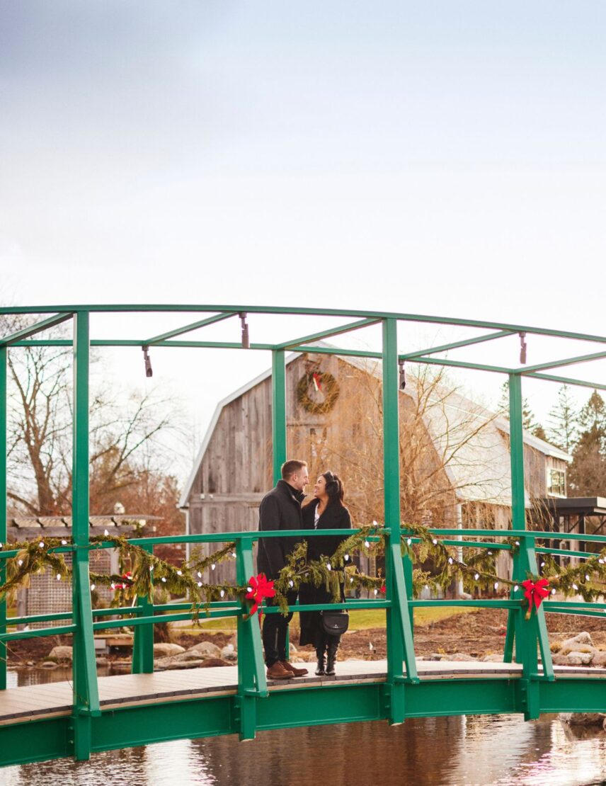 A couple enjoys the Christmas Wonderland Gardens at Pillar and Post in Niagara on the Lake
