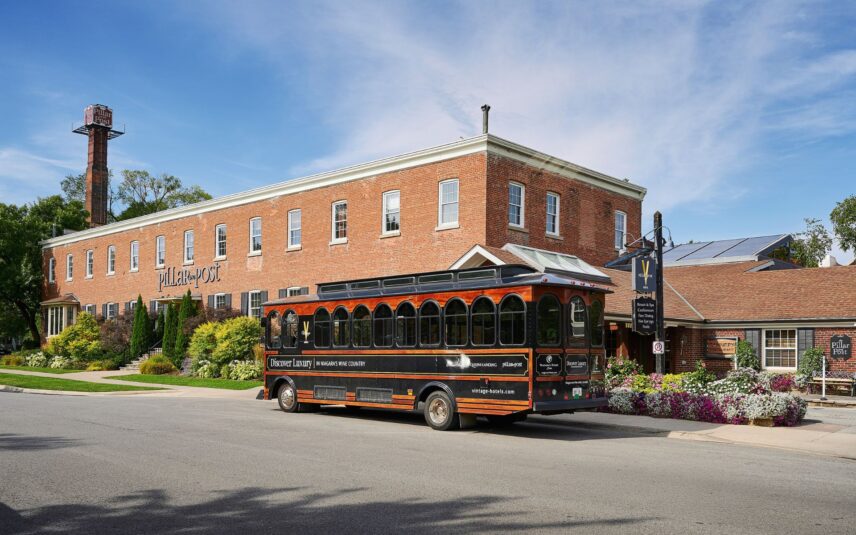 Vintage Hotels Signature Wine Trolley parked in front of the historic Pillar and Post in Niagara-on-the-Lake.