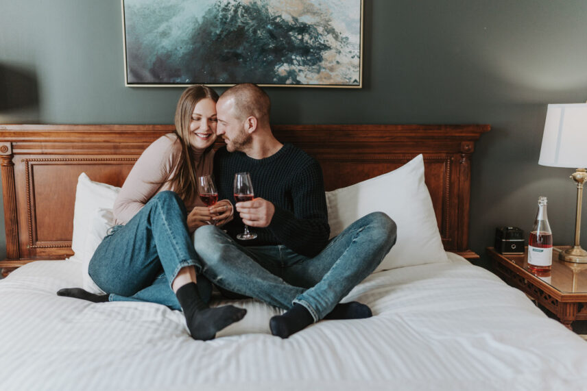 Couple in a stylish winter guest room at Inn On The Twenty in Jordan Village