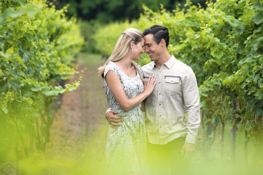 Couple proposing in vineyard at sunset in Niagara Benchlands