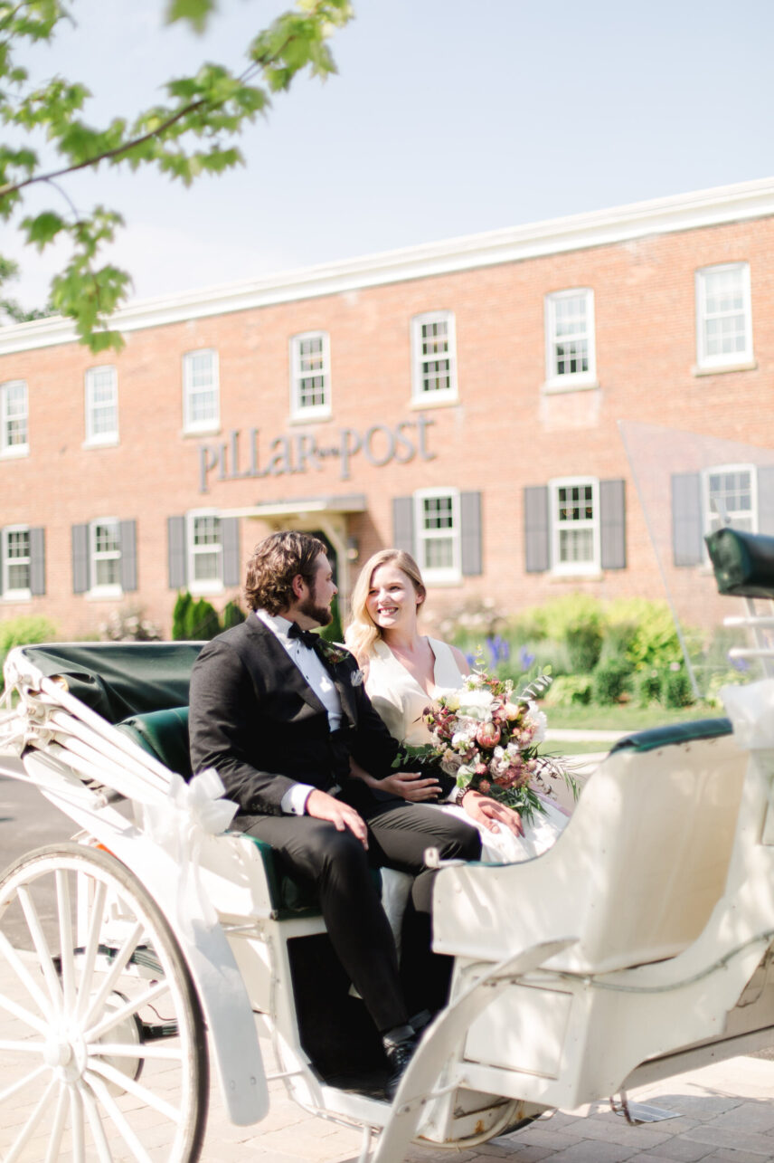 Experienced wedding planners at Vintage Hotels guiding a couple through their outdoor garden wedding in Niagara-on-the-Lake