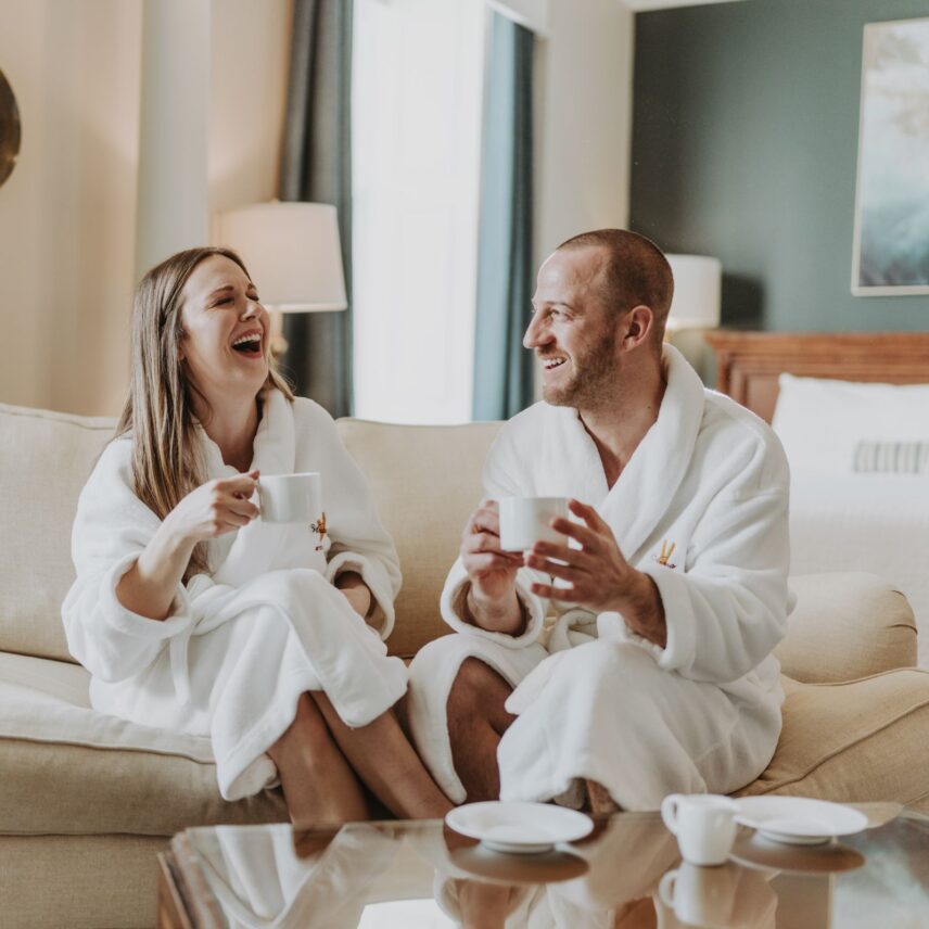 A couple enjoys coffee together during Inn On The Twenty's A'May'zing Rates getaway