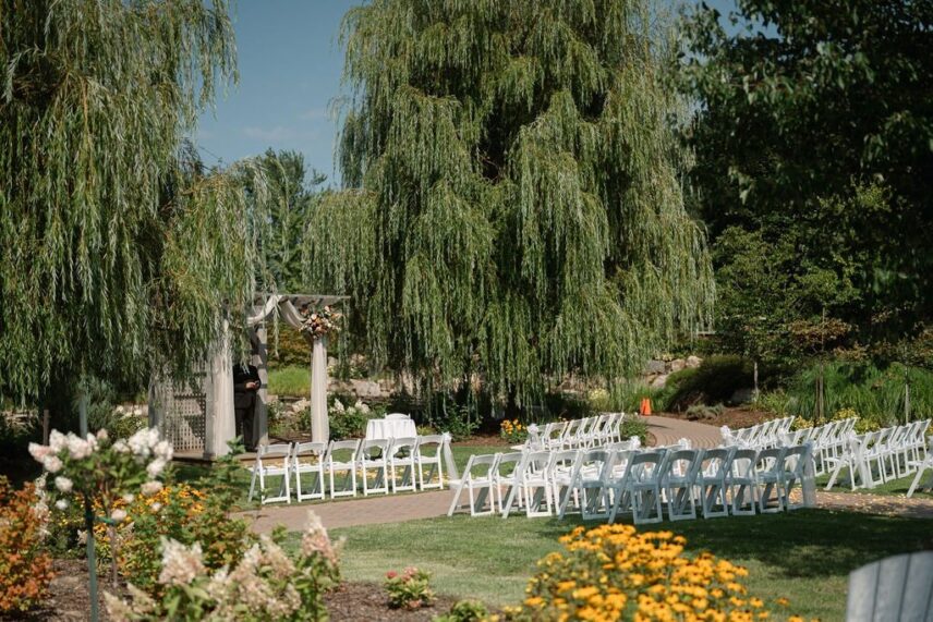 Garden wedding at Le Petit Pavilion overlooking pond and waterfall for intimate outdoor ceremonies in Niagara