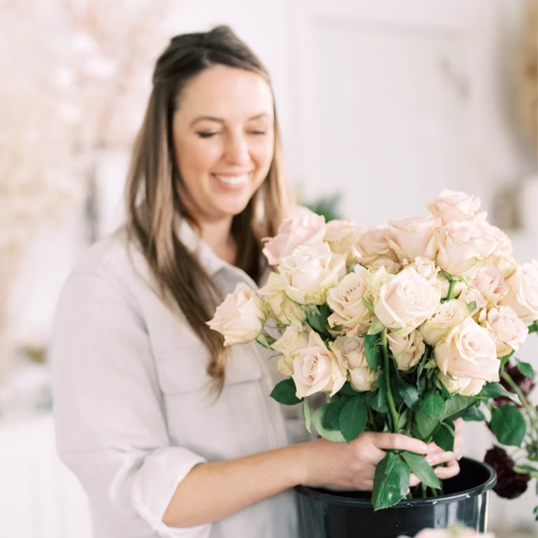 Jade Maloney creating whimsical garden-style floral installation