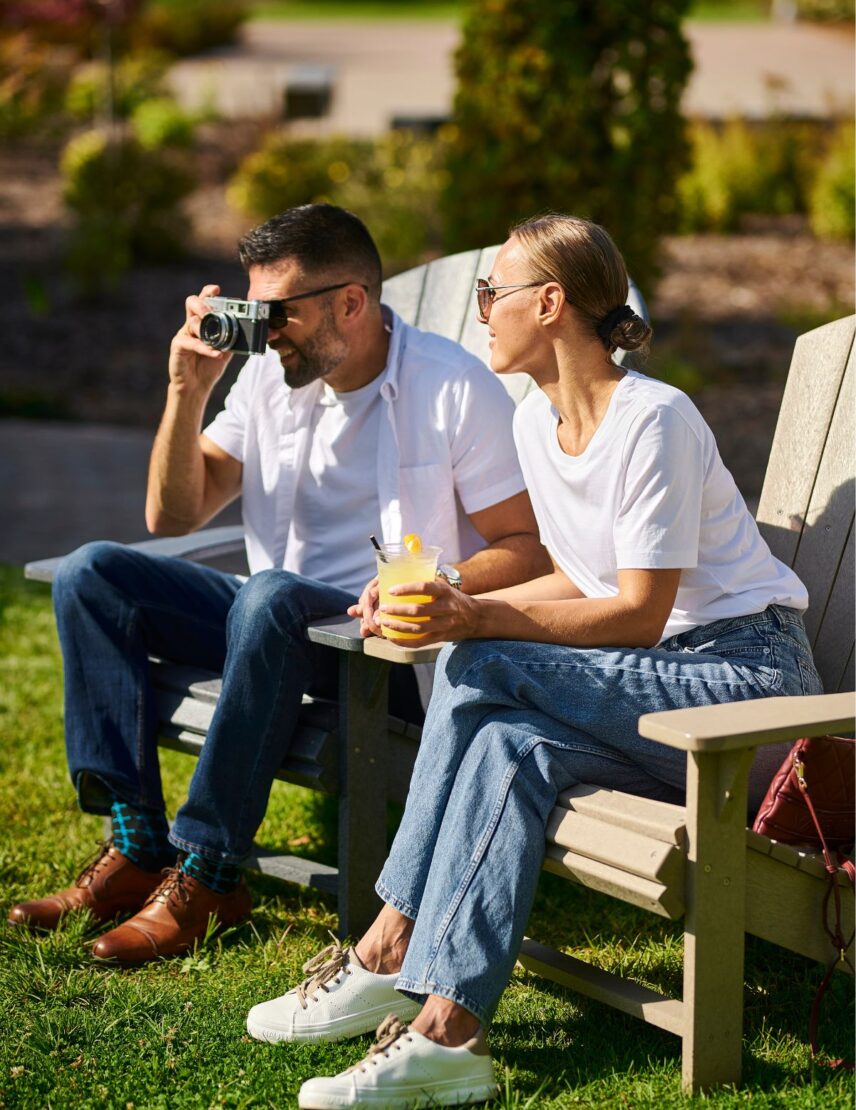 A couple enjoys the Sip and Savour event in The Gardens at Pillar and Post with Vintage Hotels