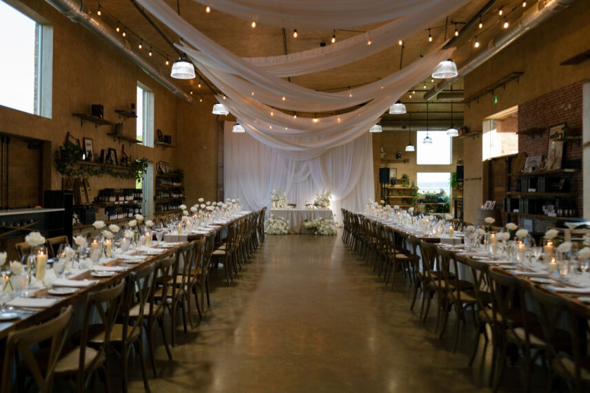 Dramatic draping at The Hare Wine Co. wedding ceremony with flowing fabric and soft lighting