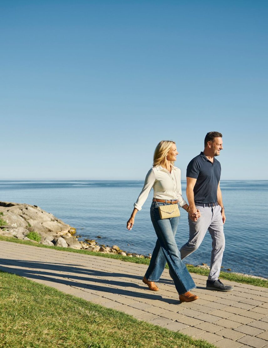 A couple walks through Queen's Royal Park in Niagara-on-the-Lake.