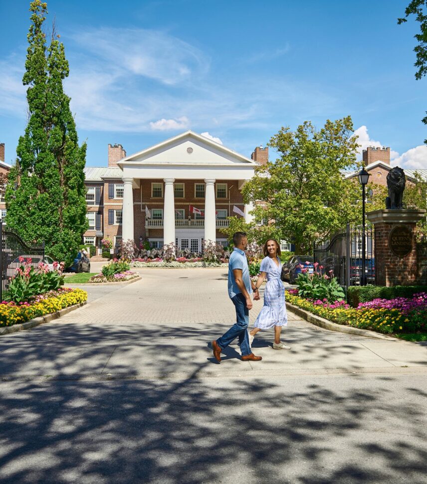 A couple walks by Queen's Landing Hotel in Niagara-on-the-Lake on Canada Day