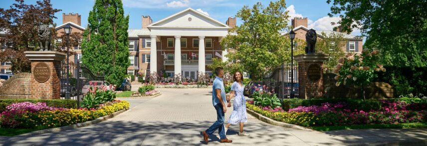 A couple walks by Queen's Landing Hotel in Niagara-on-the-Lake on Canada Day
