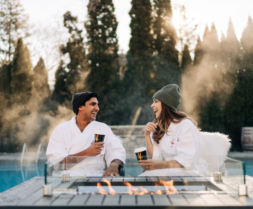 Couple warming up at the outdoor fire pits at Pillar and Post in Niagara-on-the-Lake.