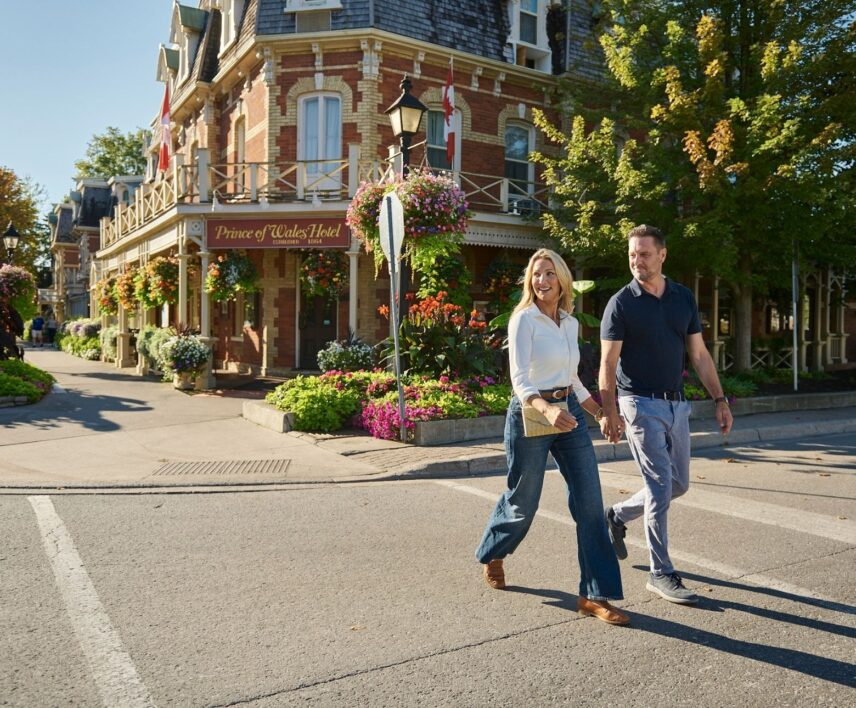 Couple walking in front of the Prince of Wales Hotel