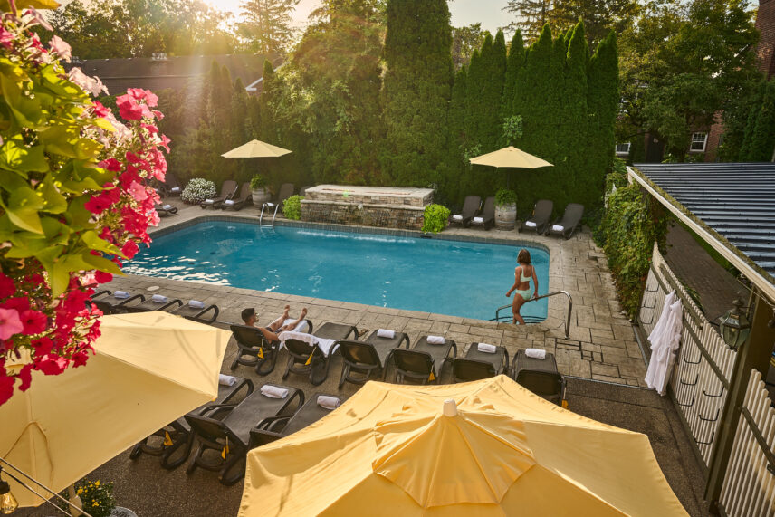 Couple relaxing in the pool at Pillar and Post during a Niagara-on-the-Lake getaway