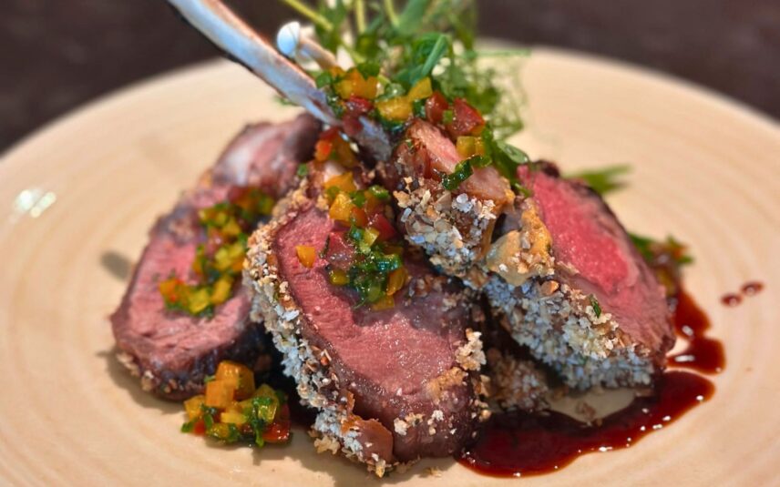 Herb Crusted Rack of Lamb featuring creamy Roasted Corn Risotto and a flavourful Sun-Dried Tomato Jus