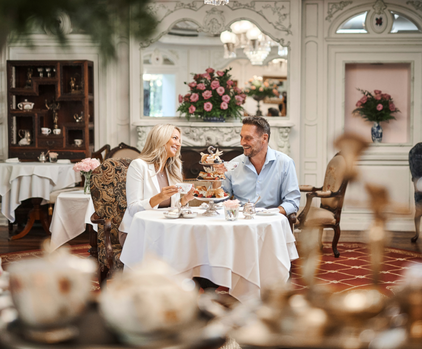 Couple dining on traditional afternoon tea in The Drawing Room at the Prince of Wales hotel, Niagara-on-the-Lake
