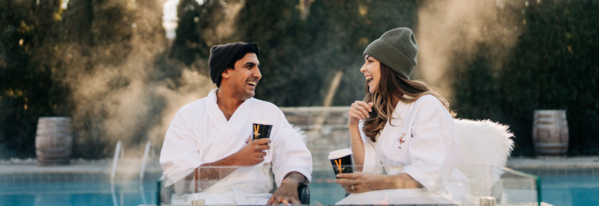 Couple at heated outdoor pool at the Pillar & Post Niagara-on-the-Lake